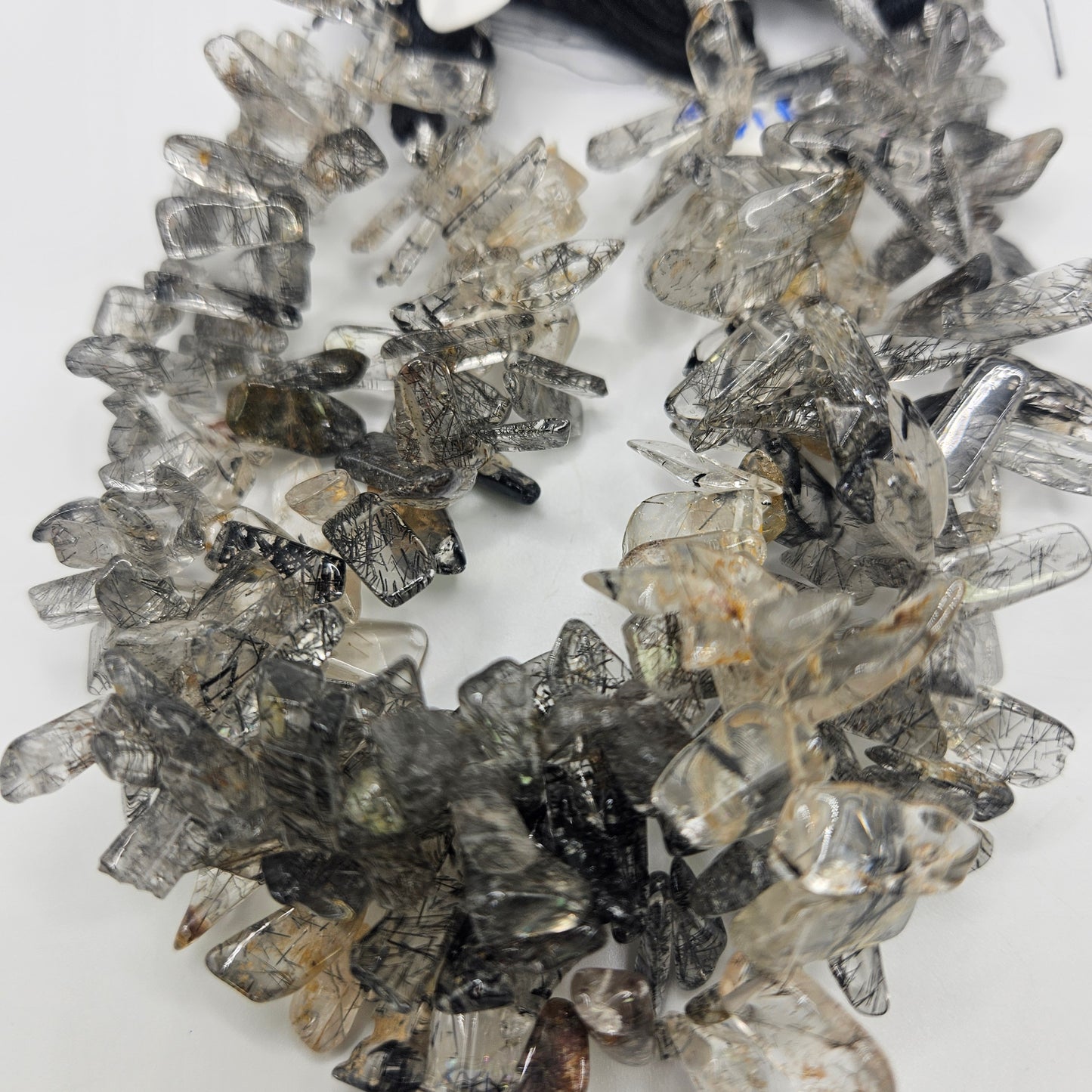 large rutilated quartz chips bead strand.