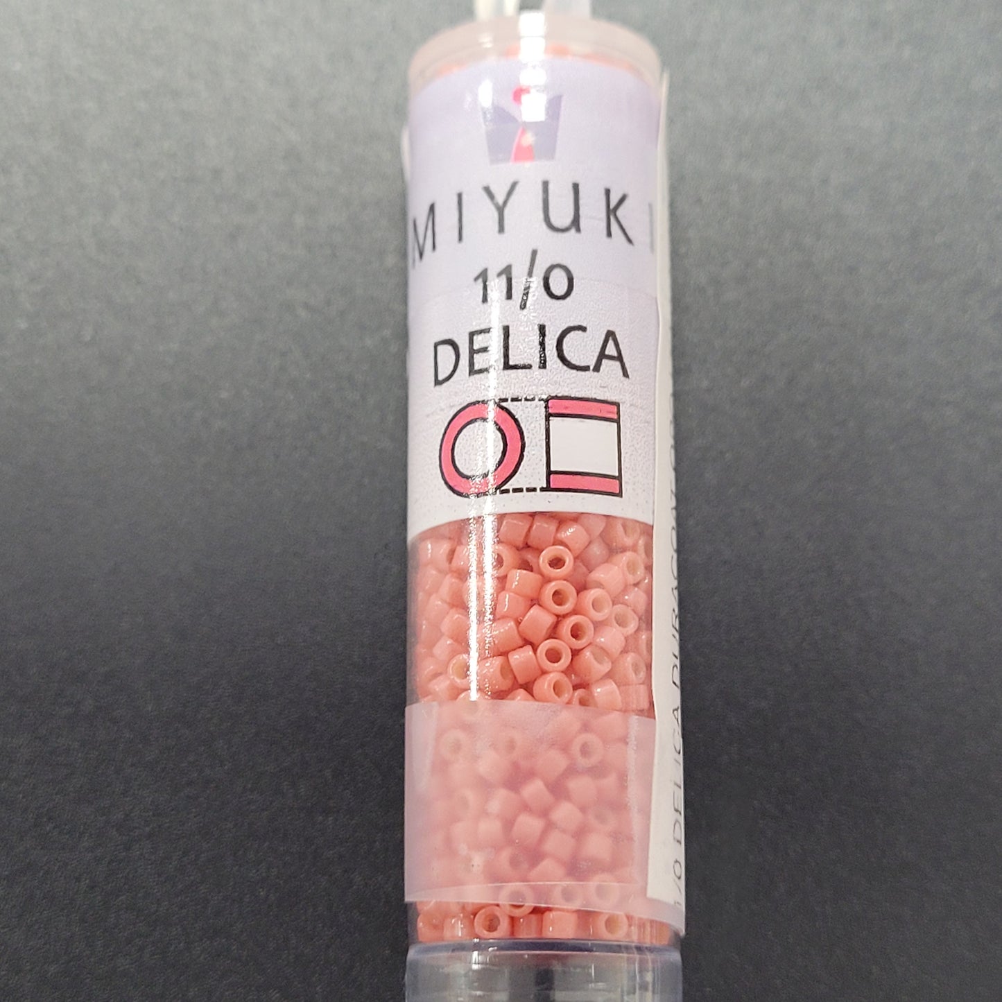 SIZE 11 DELICA DURACOAT SEED BEAD IN OPAQUE LIGHT WATERMELON COLOR.