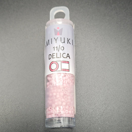 SIZE 11 DELICA SEED BEADS IN OPAQUE OLD ROSE LUSTER COLOR.
