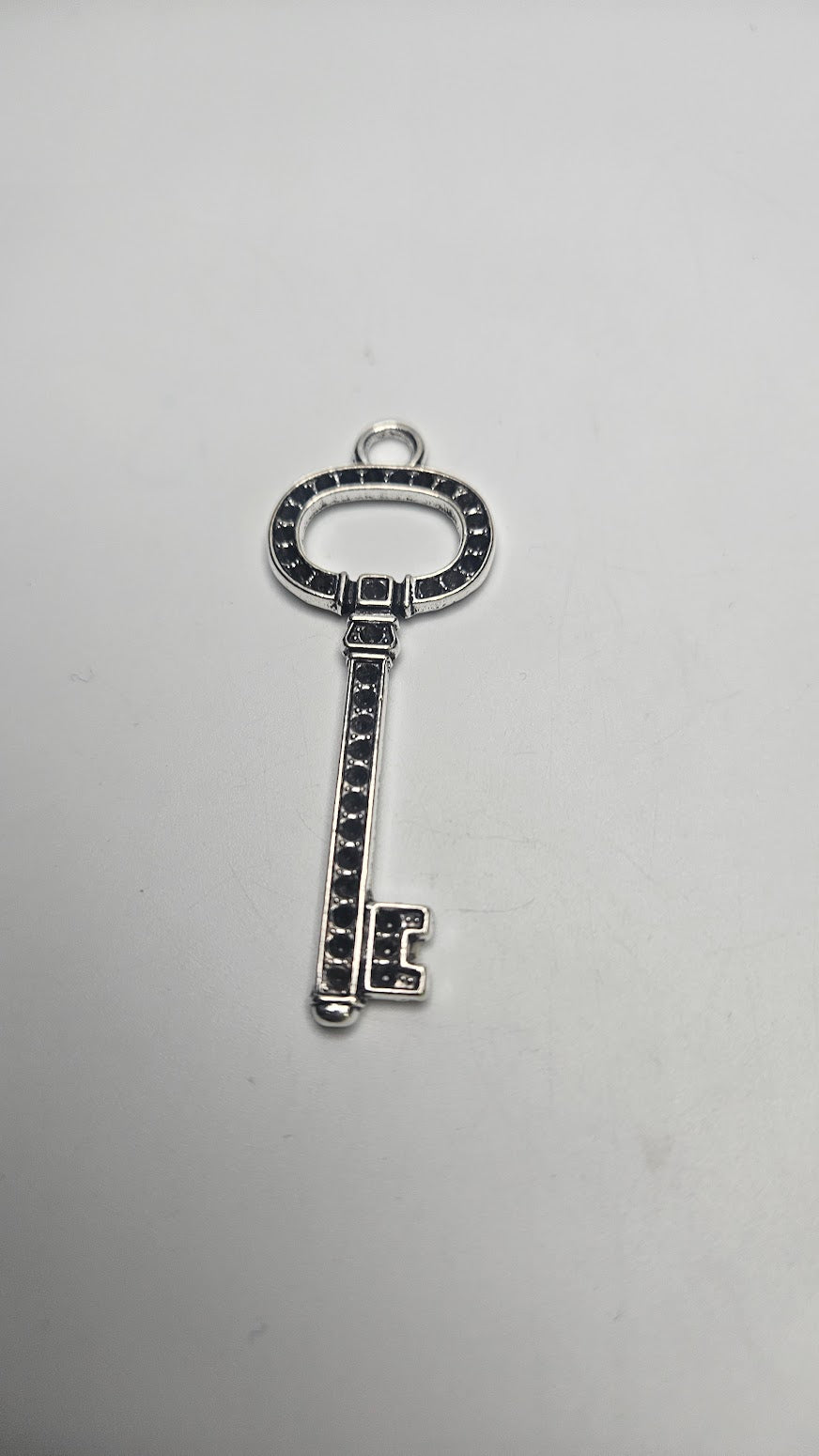 Silver Colored large key Pewter Charm.