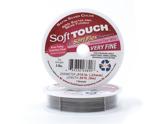 The Soft Touch Soft Flex 0.10 DIA 30 FT Very Fine is a spool of premium flex wire in satin silver color, ideal for jewelry making. It boasts features such as stainless steel construction, nylon coating, the ability to tie knots, and a fine diameter of .010 inches. Its length measures 30 feet with a strength capacity of 5 pounds.