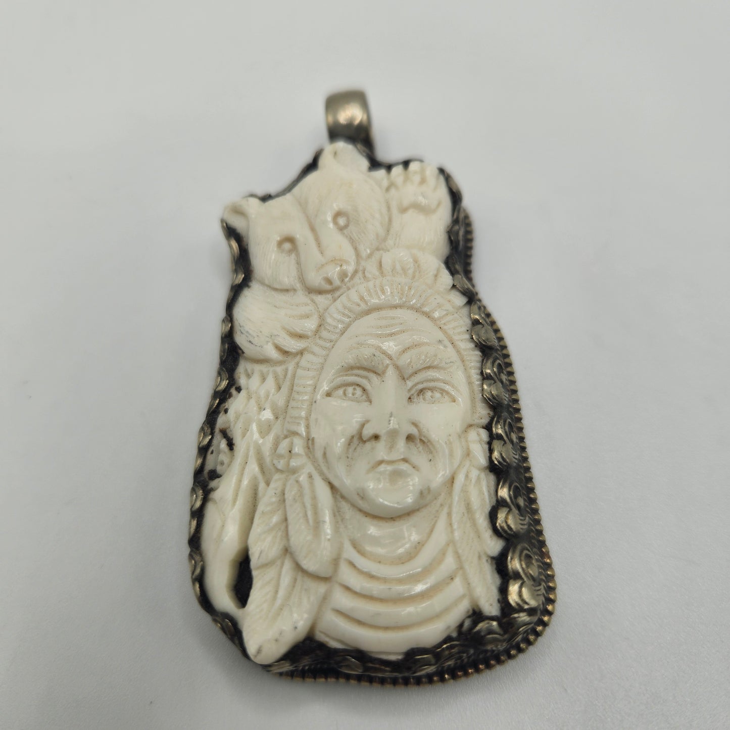 Sterling Silver Carved Ox Bone Bear Native American Pendant.