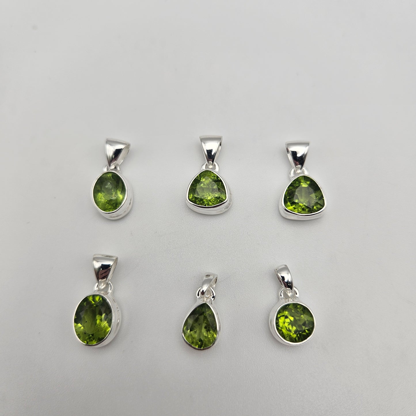 Sterling Silver Faceted Peridot Bezel Pendant.