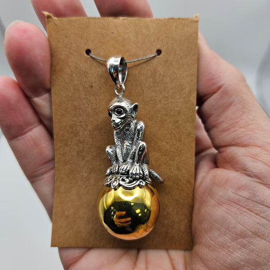 Sterling Silver Monkey on Ball Pendant.