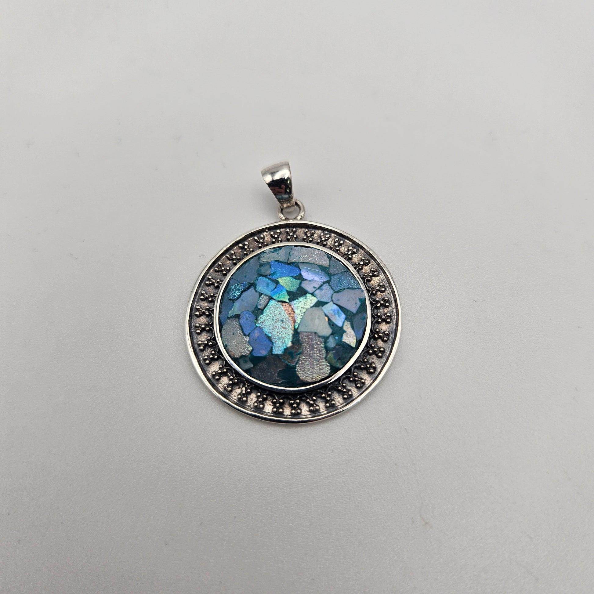 Sterling Silver Roman Glass Round Bezel Pendant.