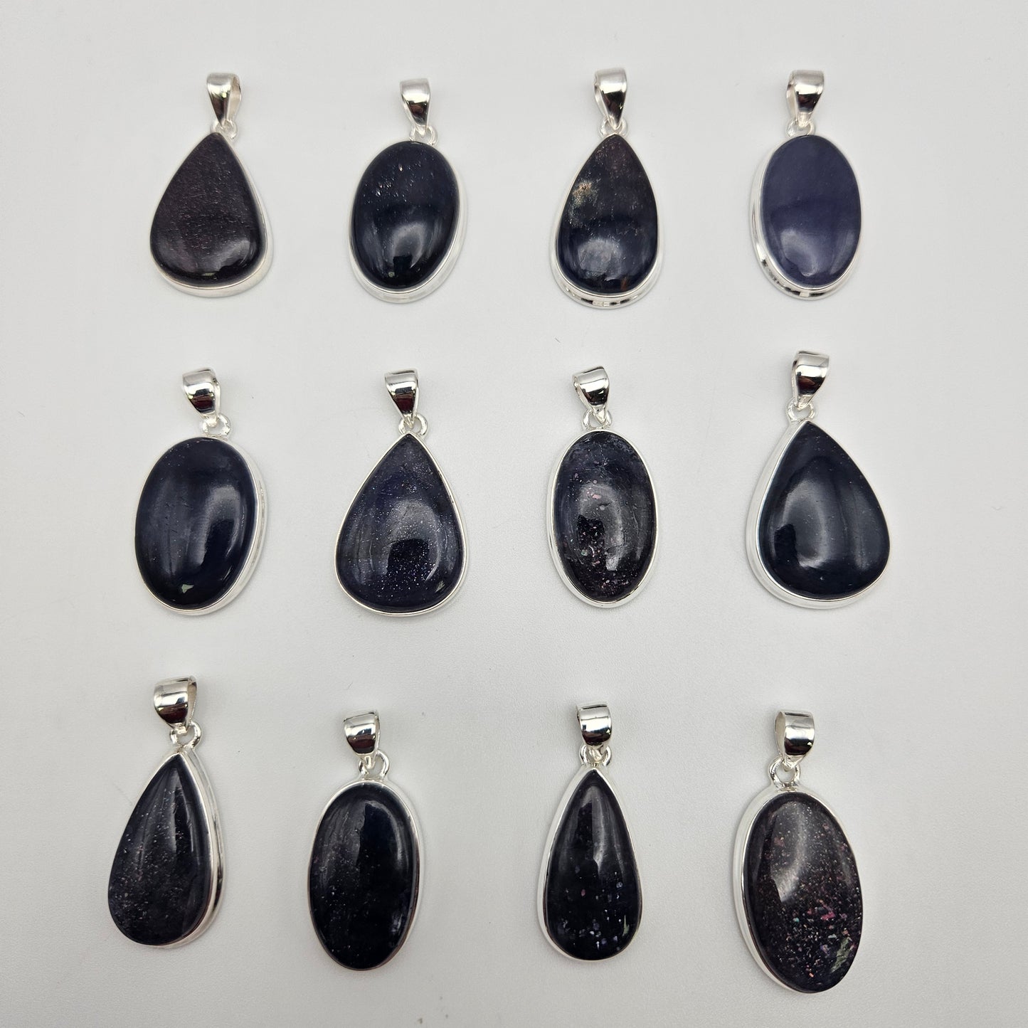 Sterling Silver Sunstone Iolite Bezel Pendant.