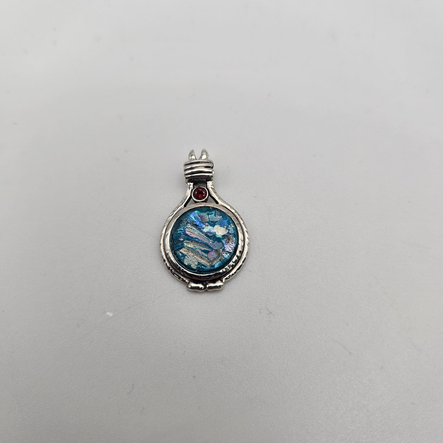 Sterling Silver Roman Glass Round with Red Stone Pendant.