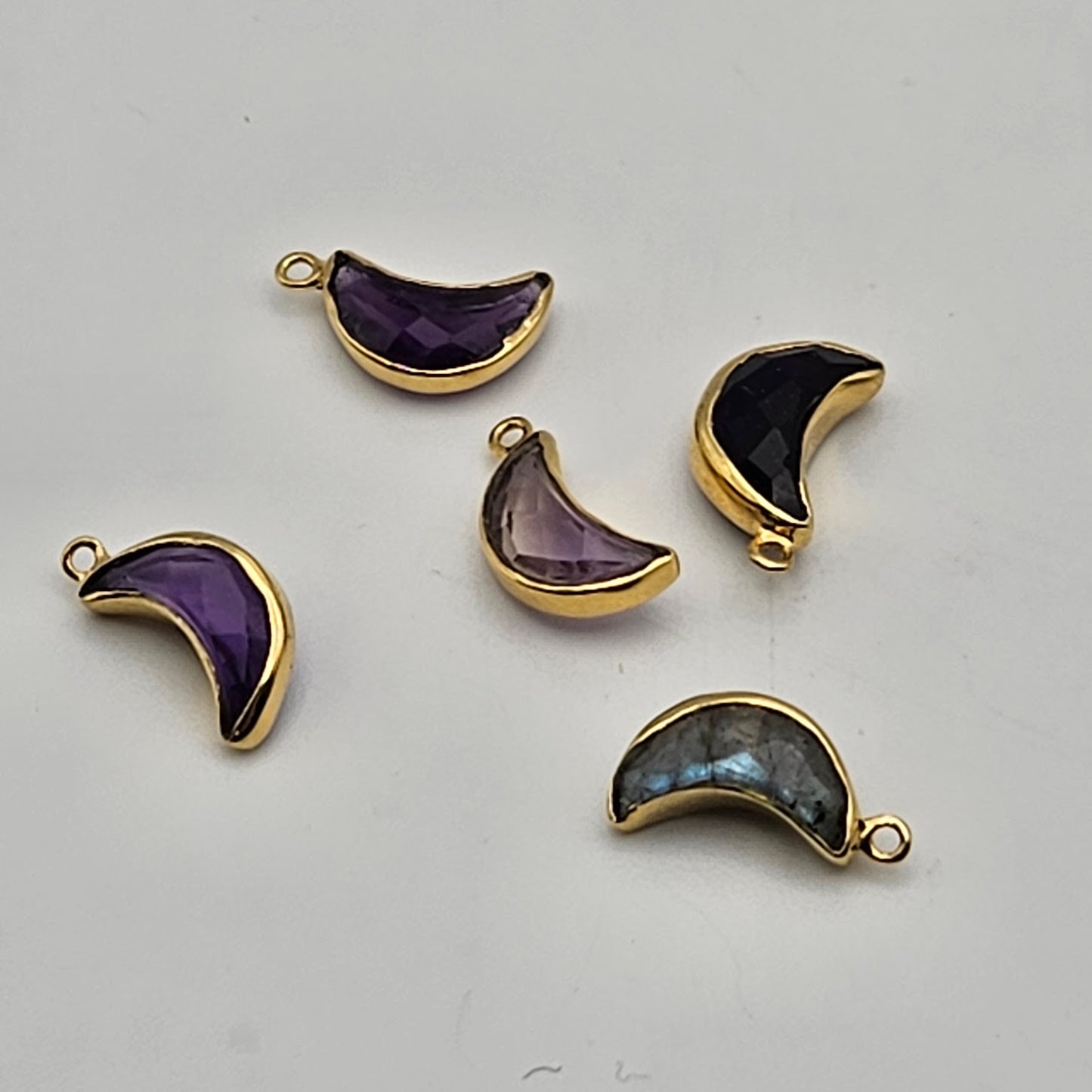 Vermeil assorted faceted moon charm.
