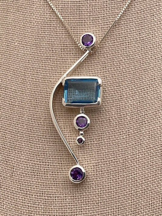 Blue Topaz Rectangle Cut on Solid Bow adorned with Amethyst Sterling Silver Pendant