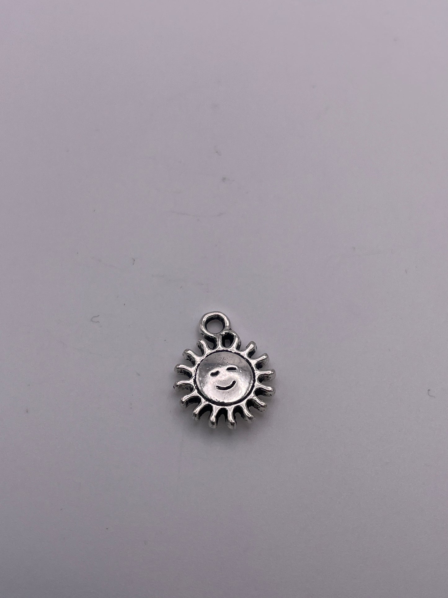 Pewter Smiling Sun Charm 1.30