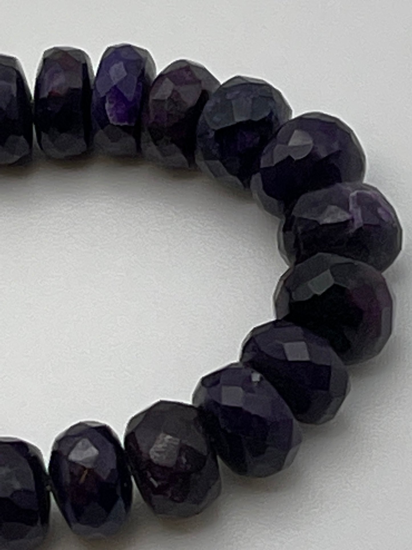 7.5mm Faceted Rondelle Sugilite bead strand.