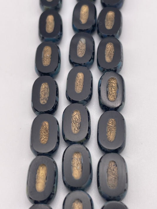 10mm Black Oval Slice With Indent Czech Bead Strand.