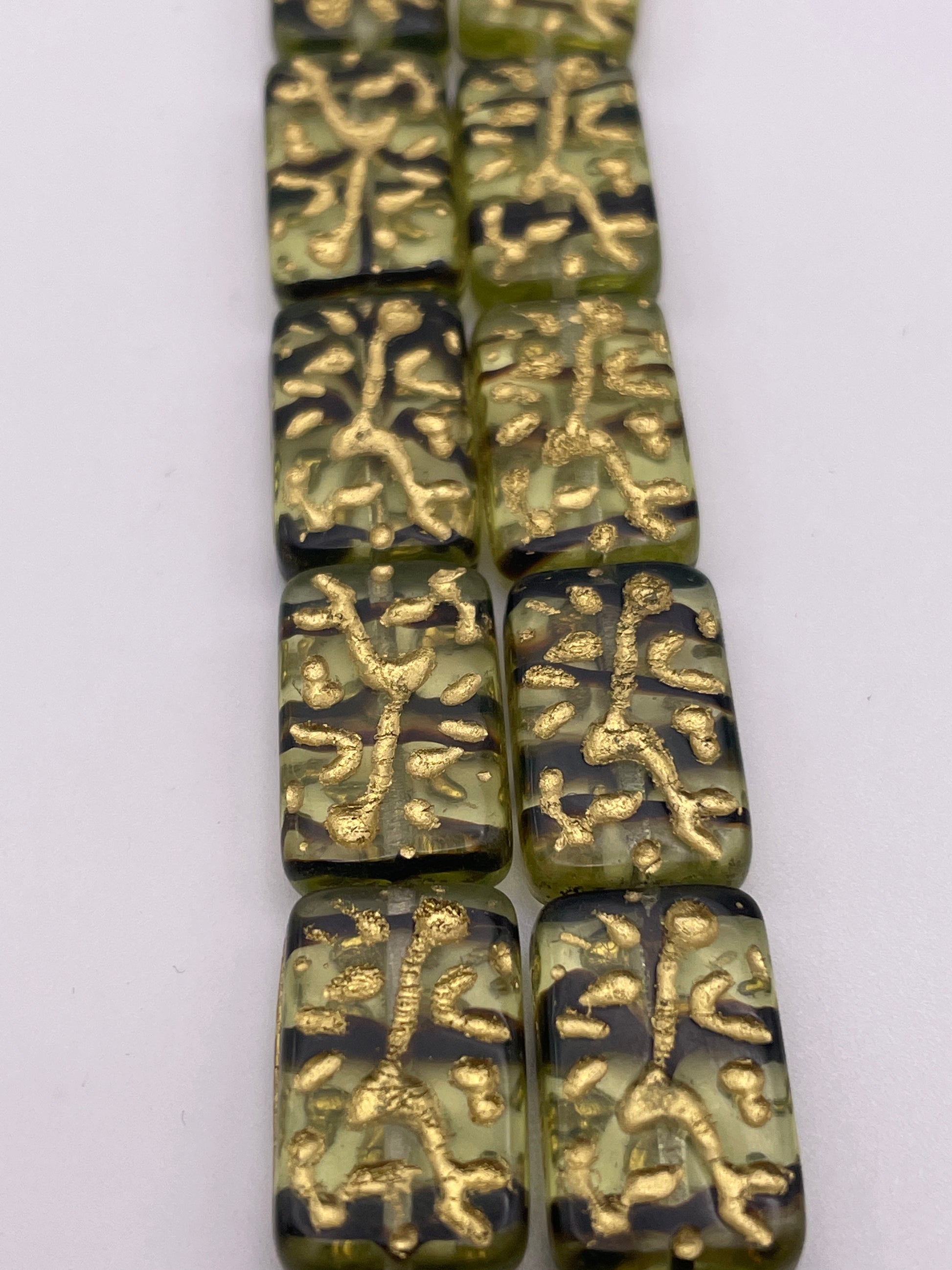 12 by 18mm Black and Green Czech Bead Strand.