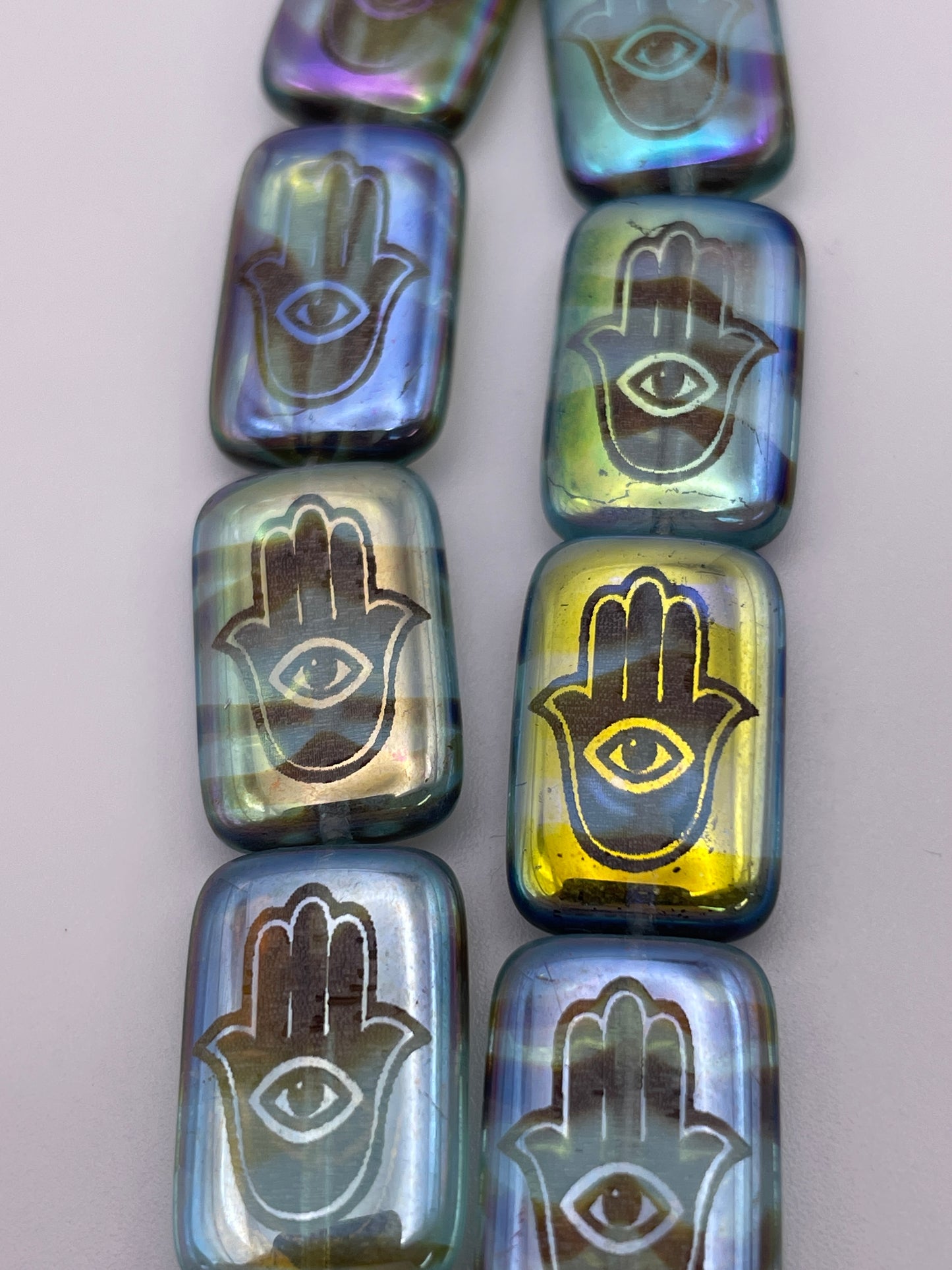 12 by 18mm Semi Transparent Hamsa Hand Czech Bead Strand.