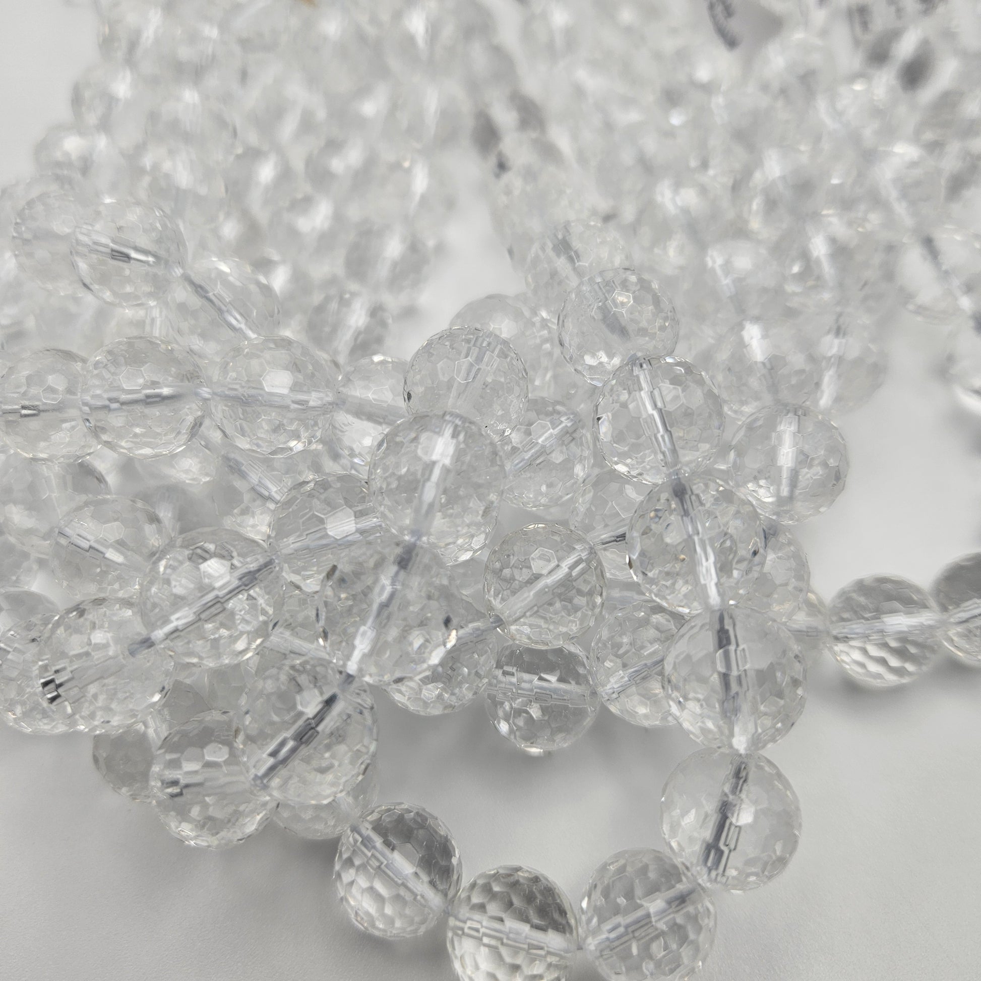 12mm Clear Quartz Faceted Round Bead Strand.