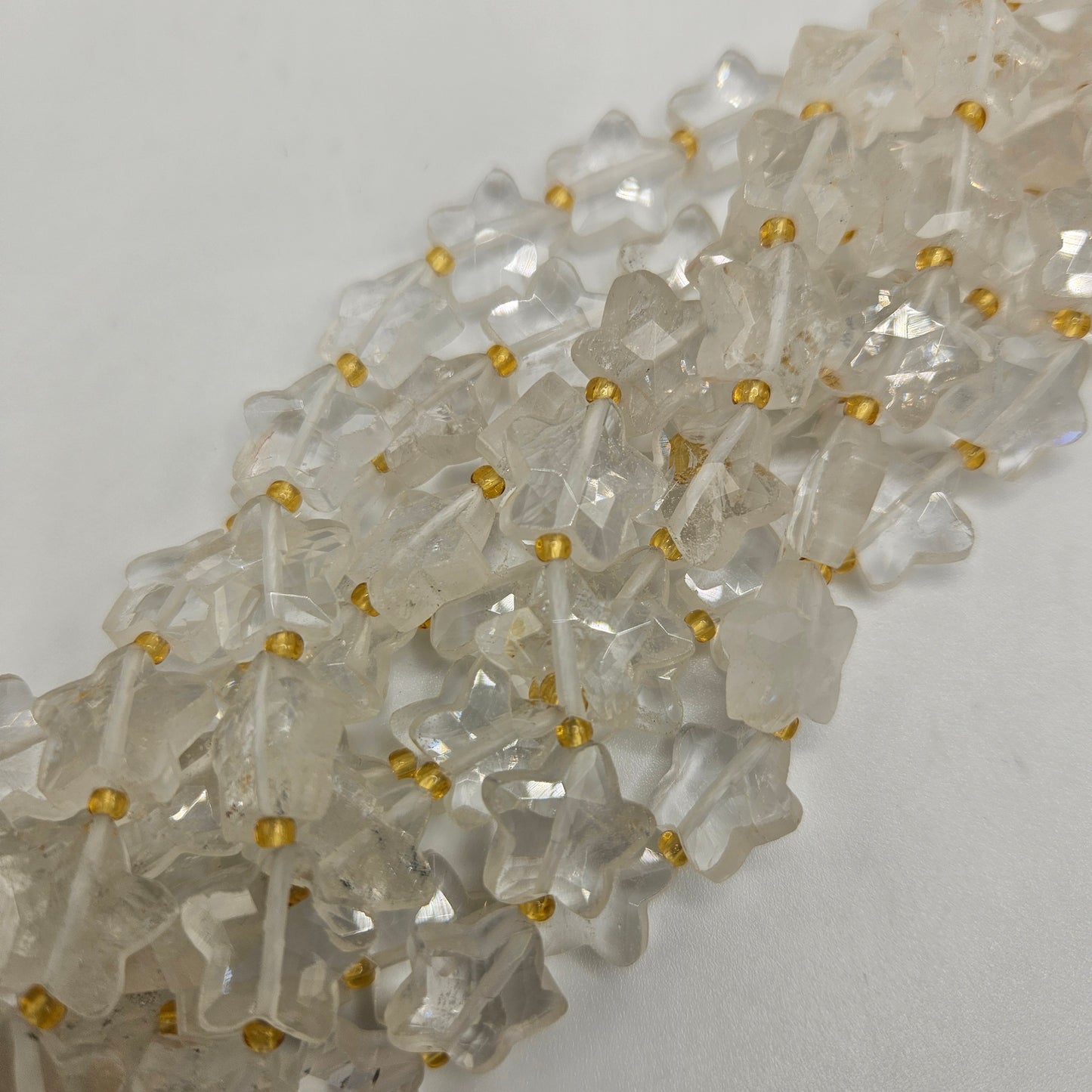 12mm Clear Quartz Star Bead Strand.