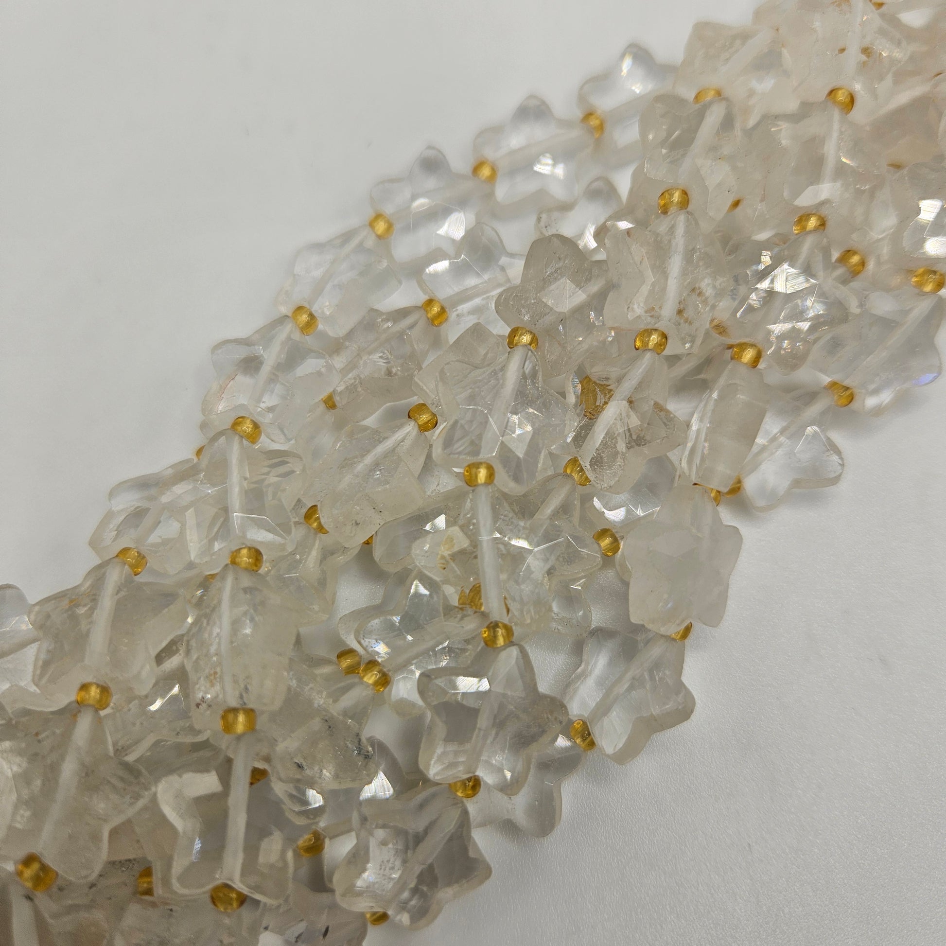 12mm Clear Quartz Star Bead Strand.