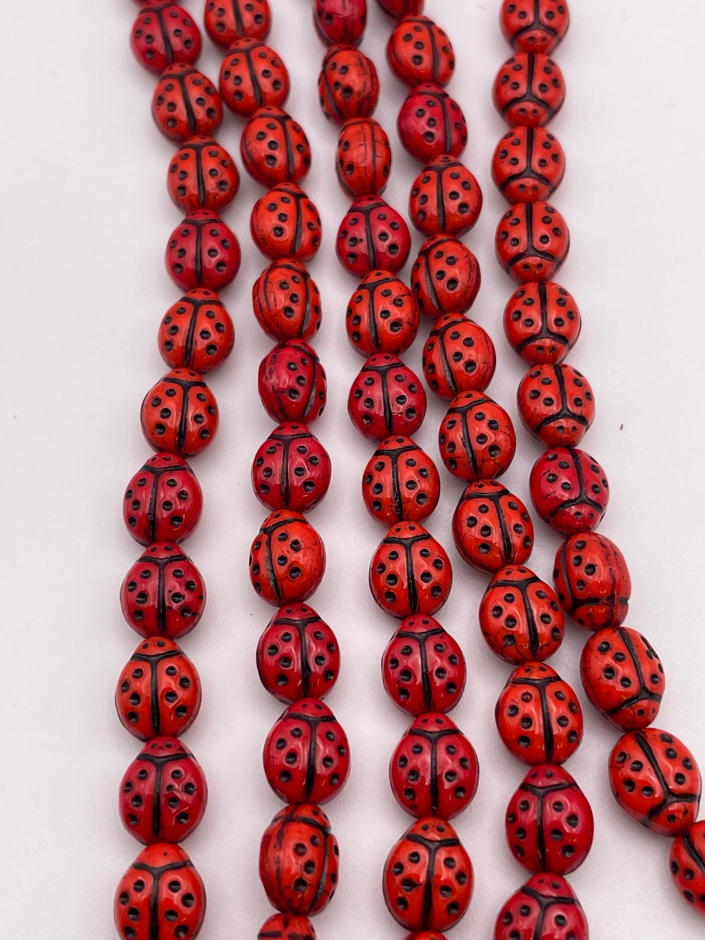 12mm Ladybug Czech Bead Strand.