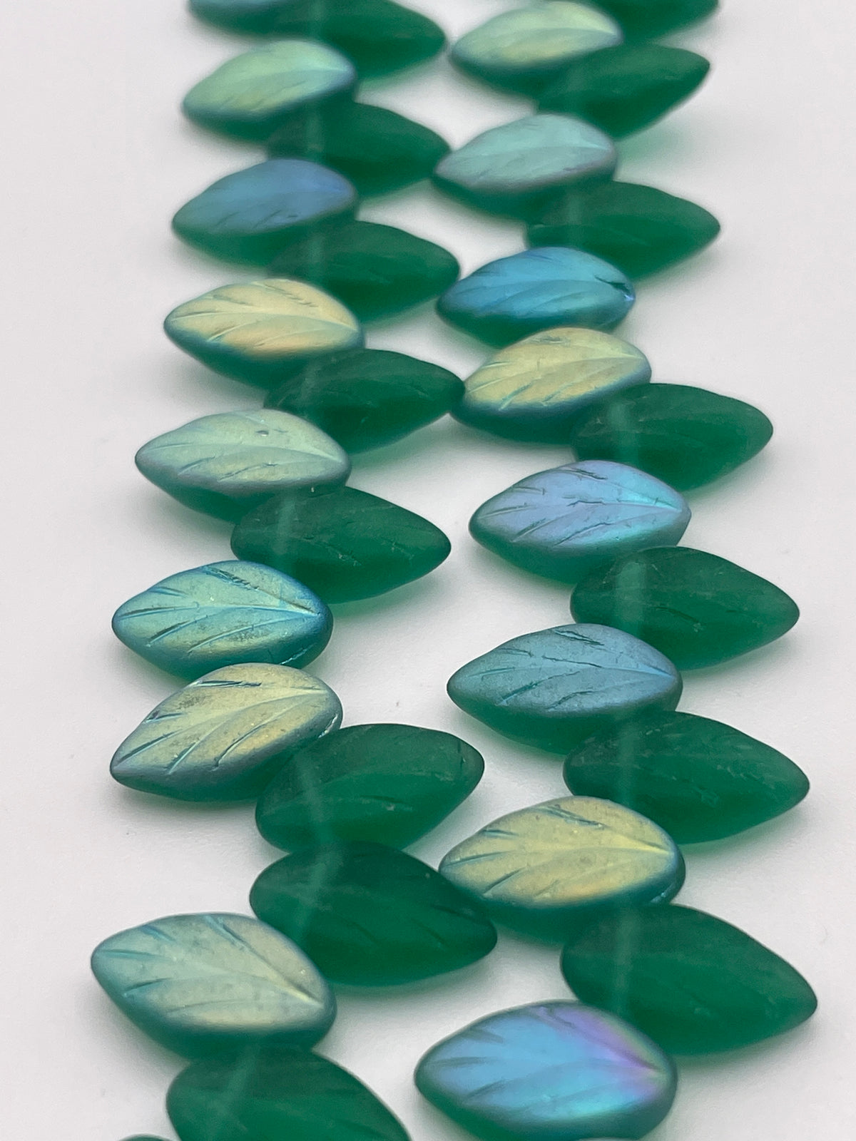 12mm Matte Green Leaf Czech Bead Strand.