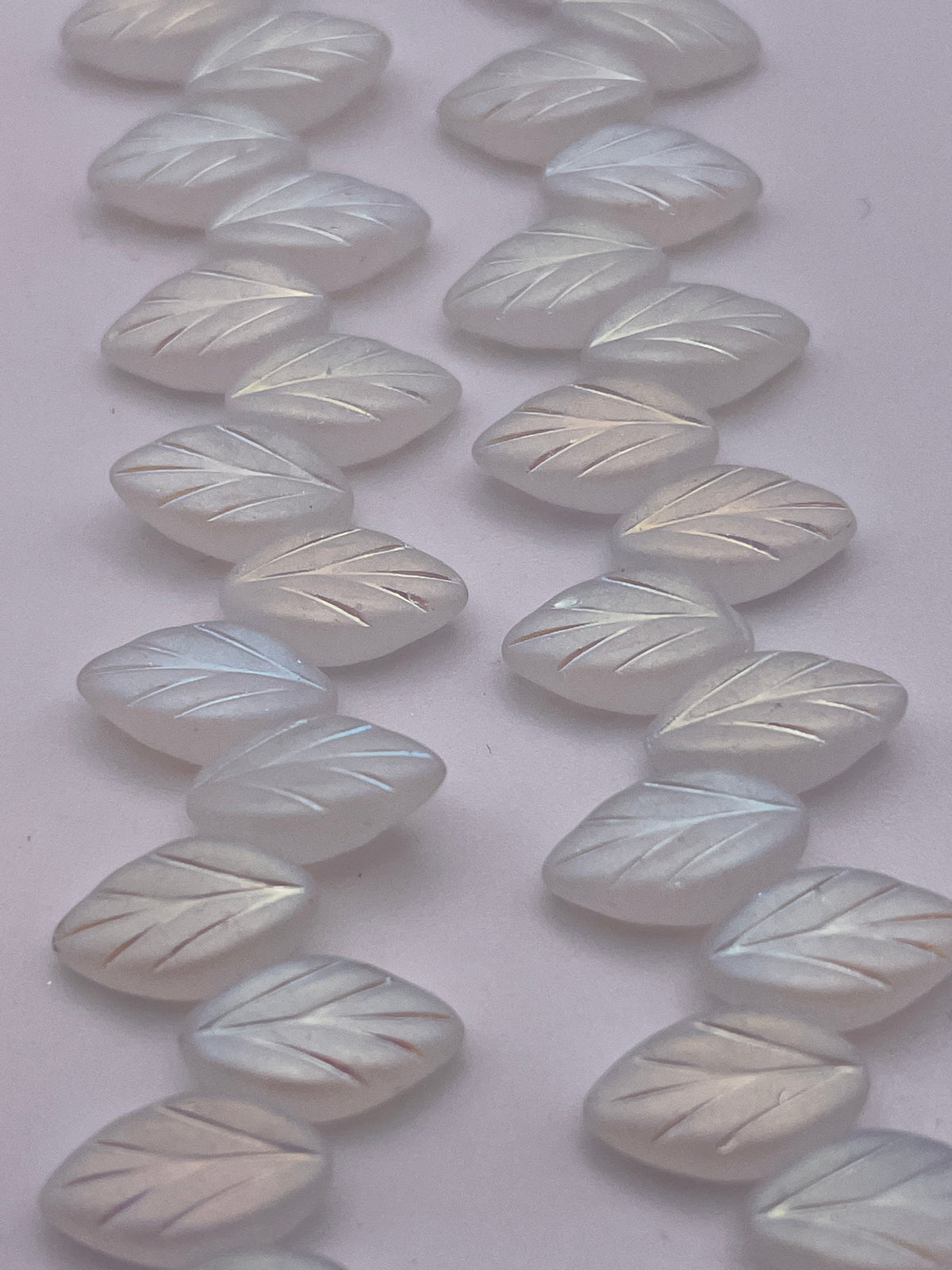 12mm Matte White Leaf Czech Bead Strand.