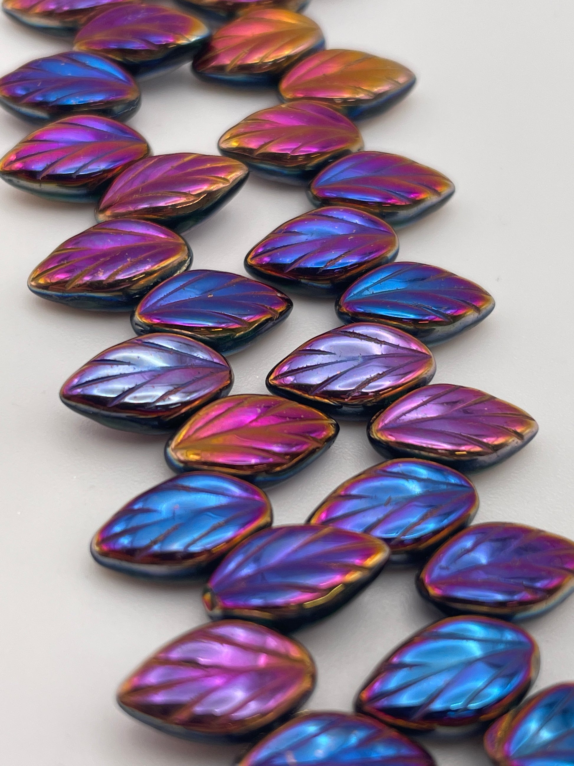 12mm Metallic Rainbow Leaf Czech Bead Strand.