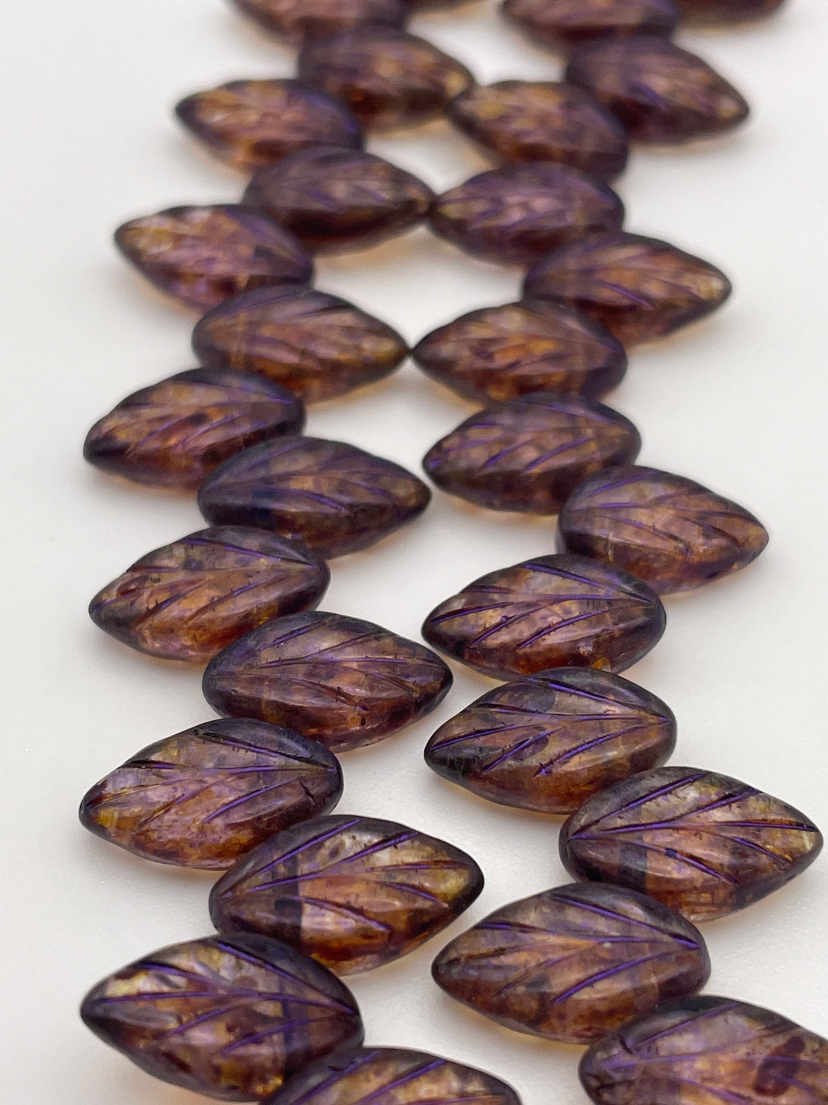 12mm Purple Leaf Czech Bead Strand.