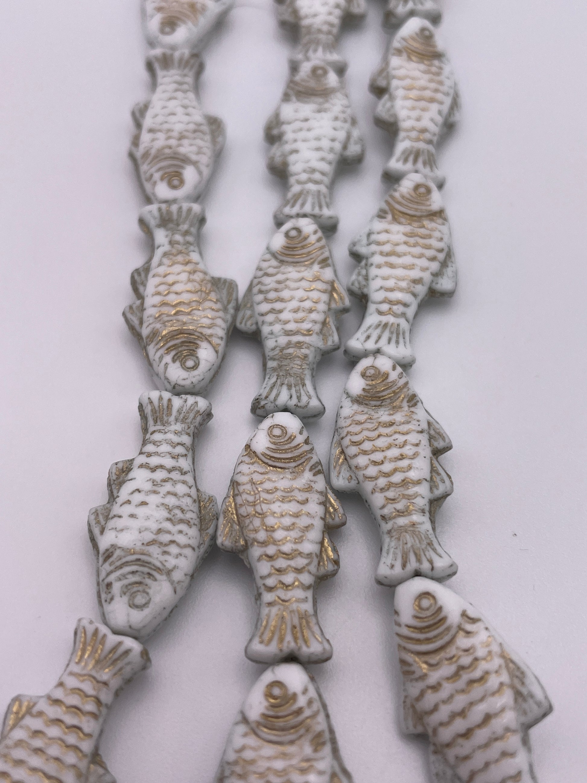 12mm White and Gold Fish Czech Bead Strand.
