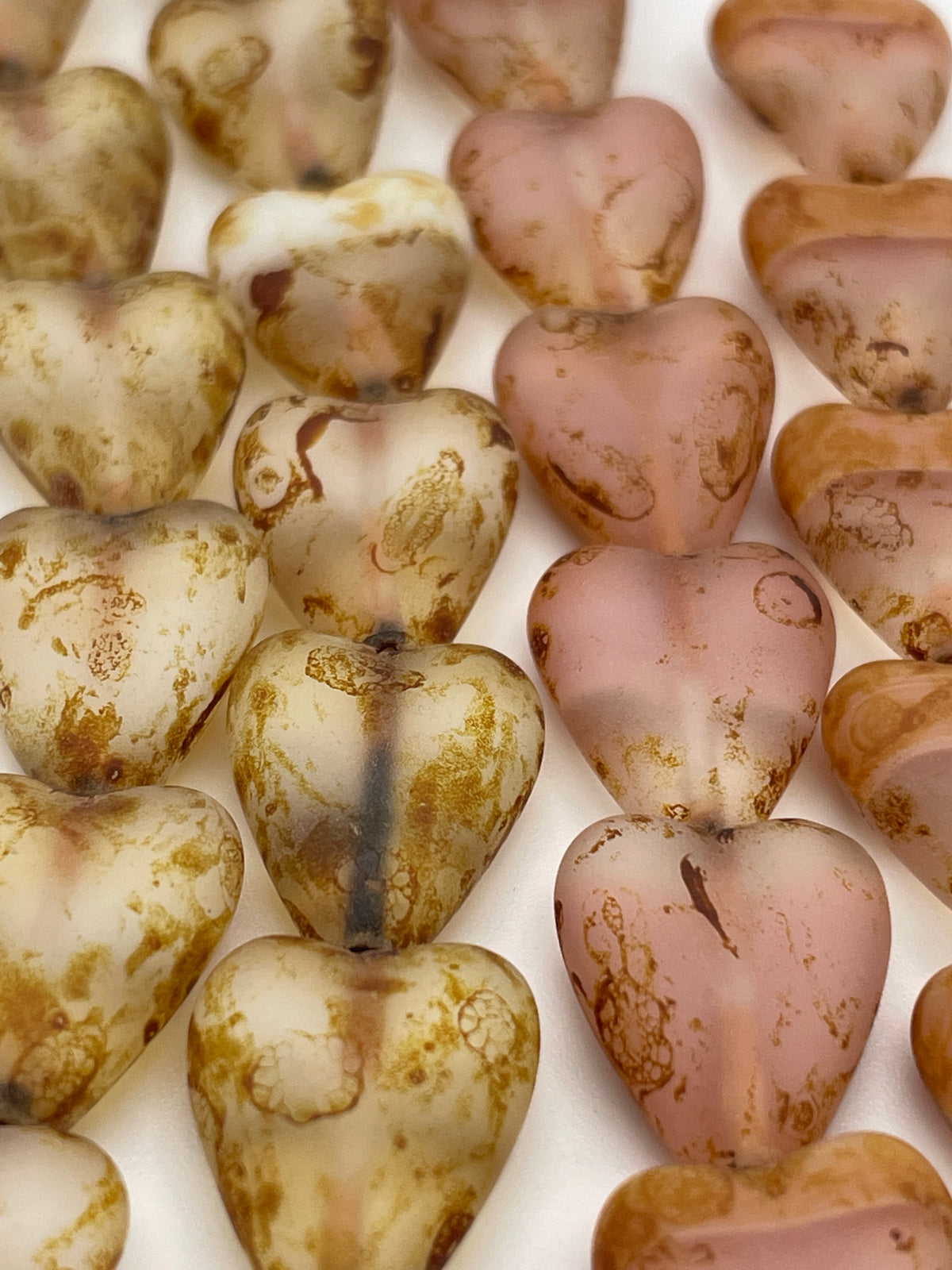 13mm Tan and Pink Banded Heart Czech Bead Strand.