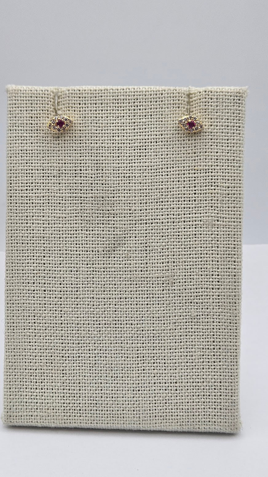 14k Gold Diamond and Ruby Evil Eye Studs.