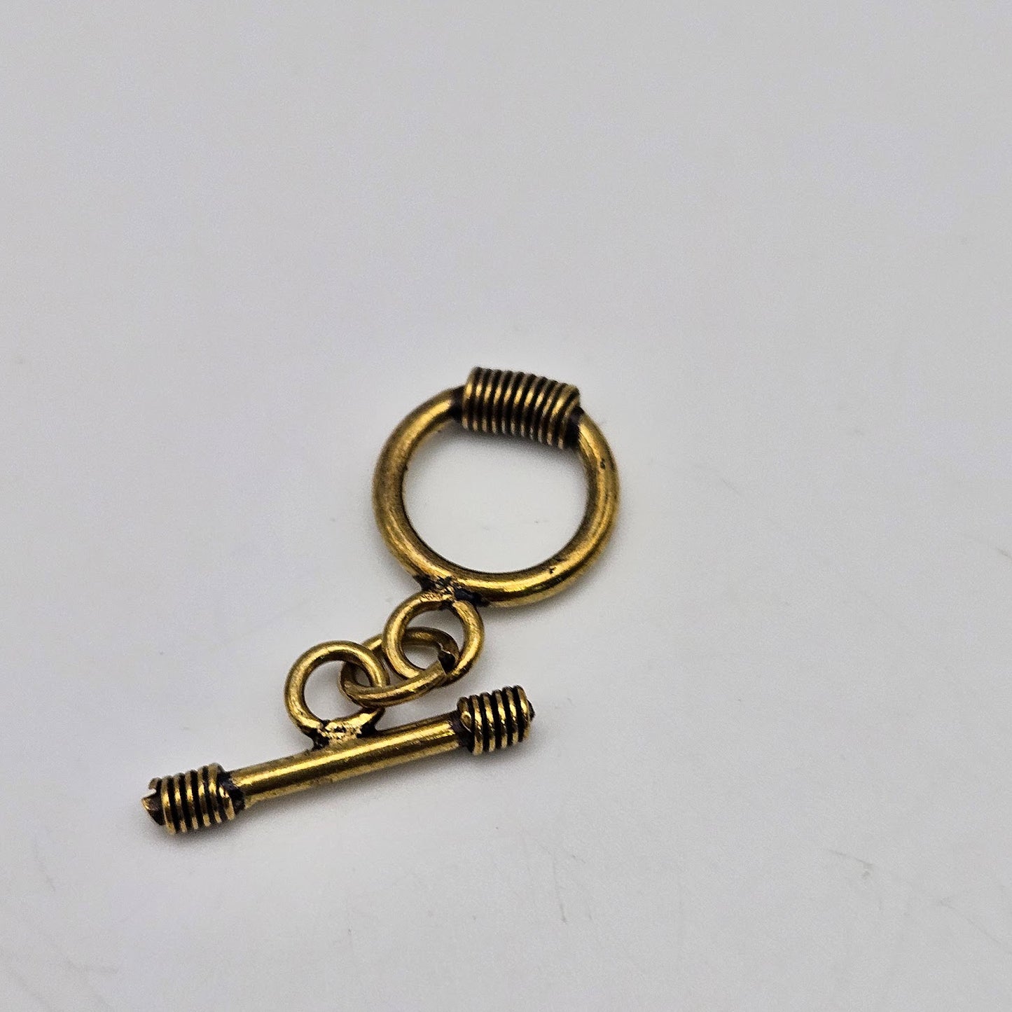 14mm Brass Colored Pewter Coil Toggle.