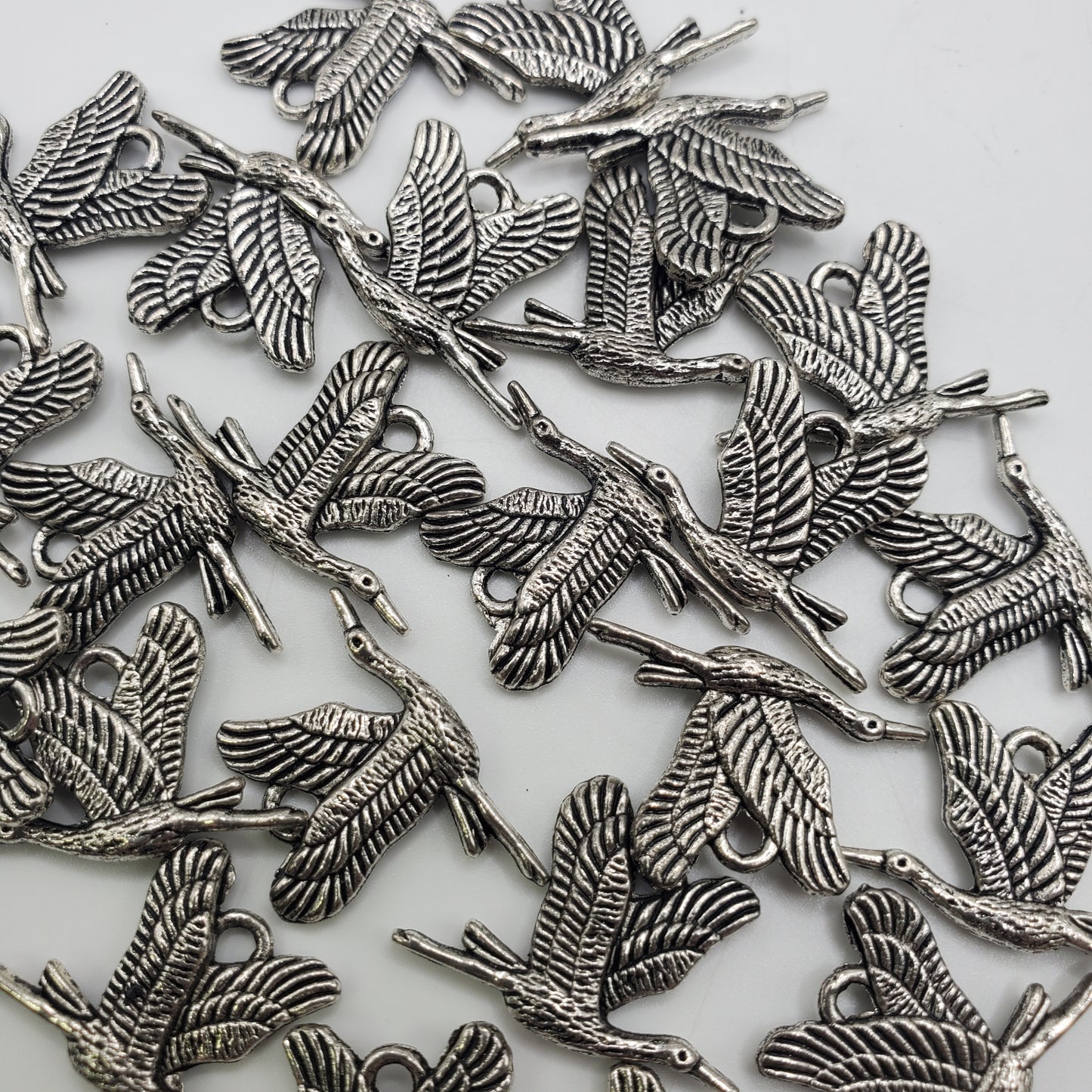 15 x 10mm Pewter Crane Charm.