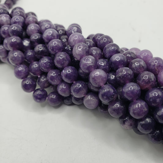 A string of purple lepidolite stones.
