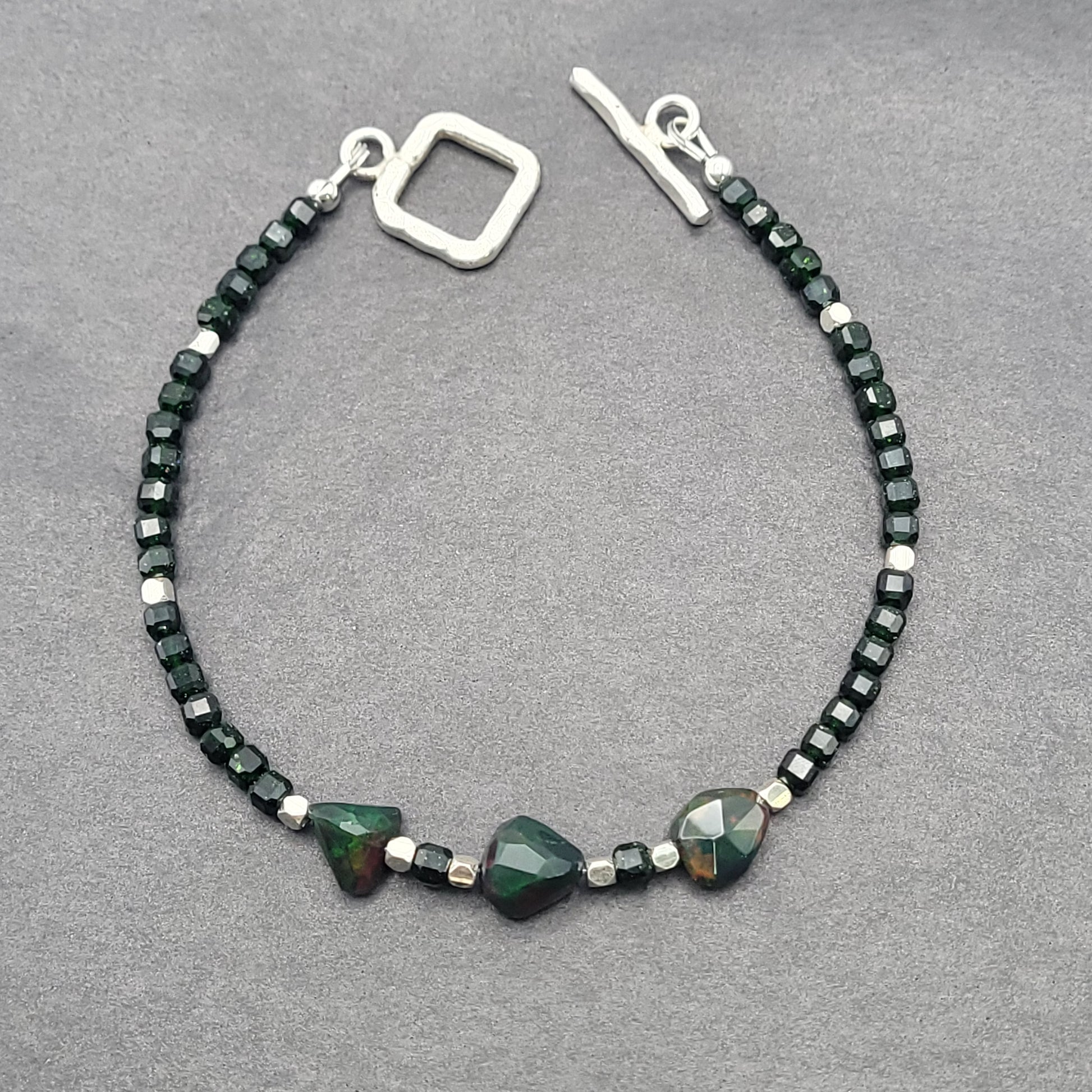Black Opal, Green Goldstone and Sterling Silver Bracelet