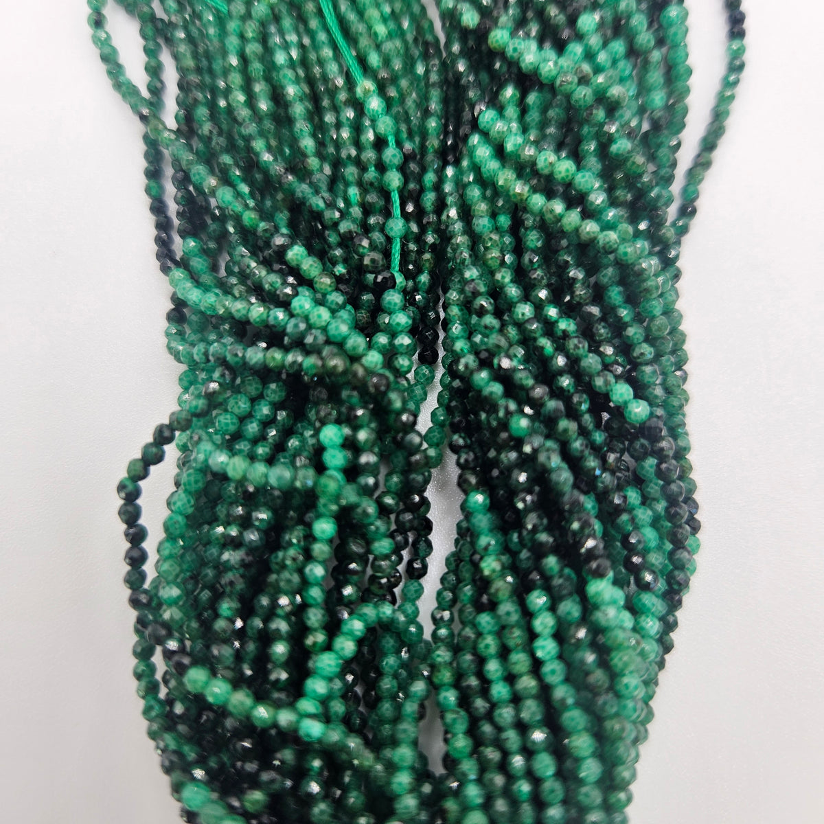 1mm Faceted Emerald Bead Strand.