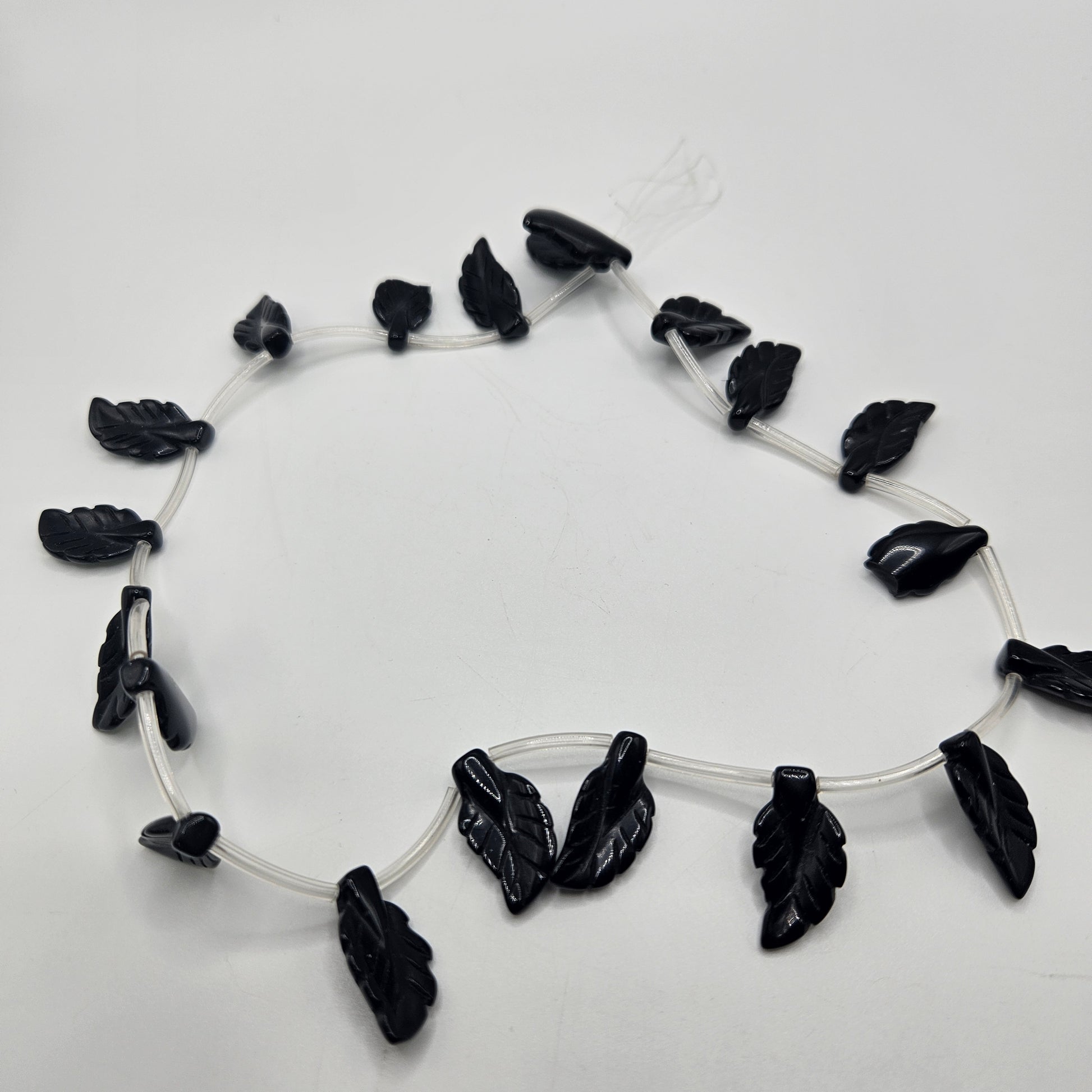 8x20mm Black Onyx Carved Leaf Bead Strand.