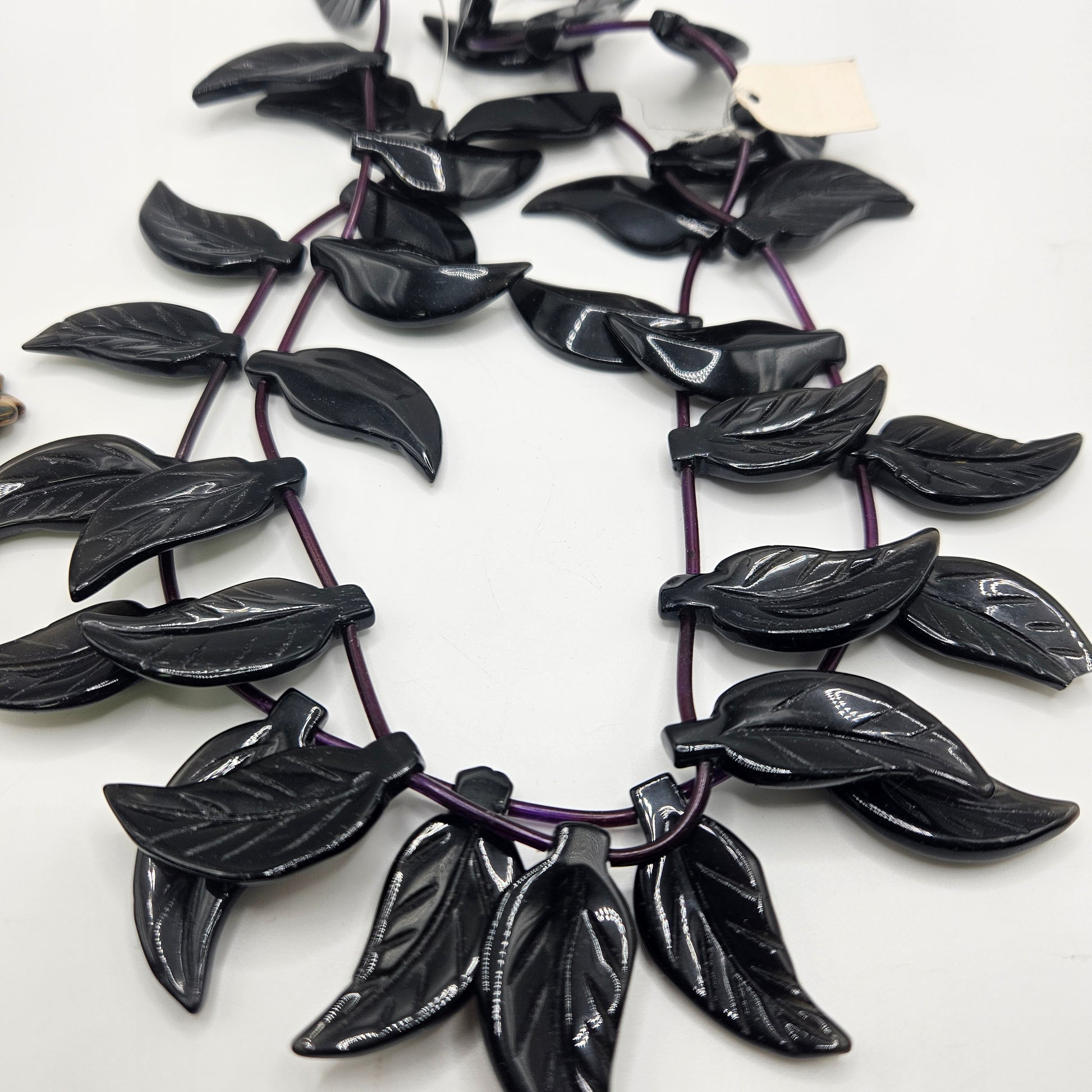 30mm Black Onyx Carved Leaf Bead Strand.