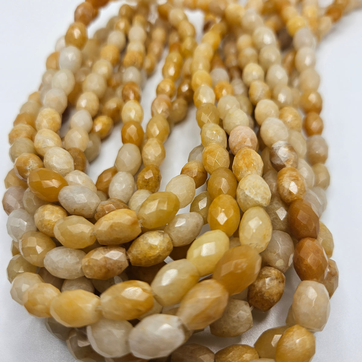 8x10mm Faceted Honey Calcite Barrel Bead Strand