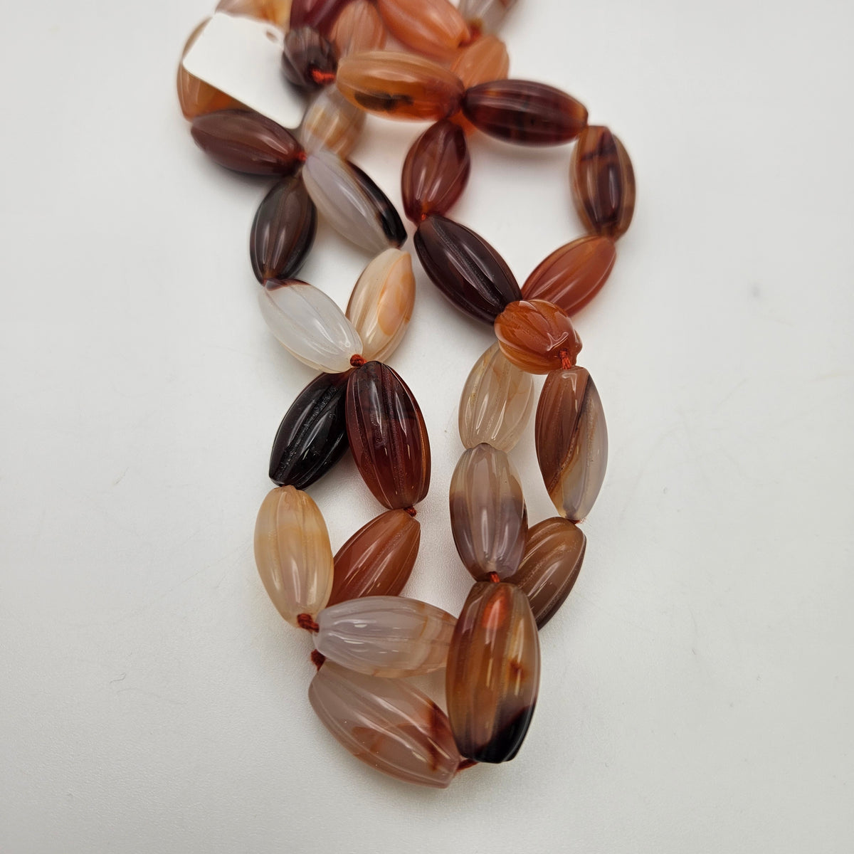 20x6mm Carnelian Twist Bead Strand.