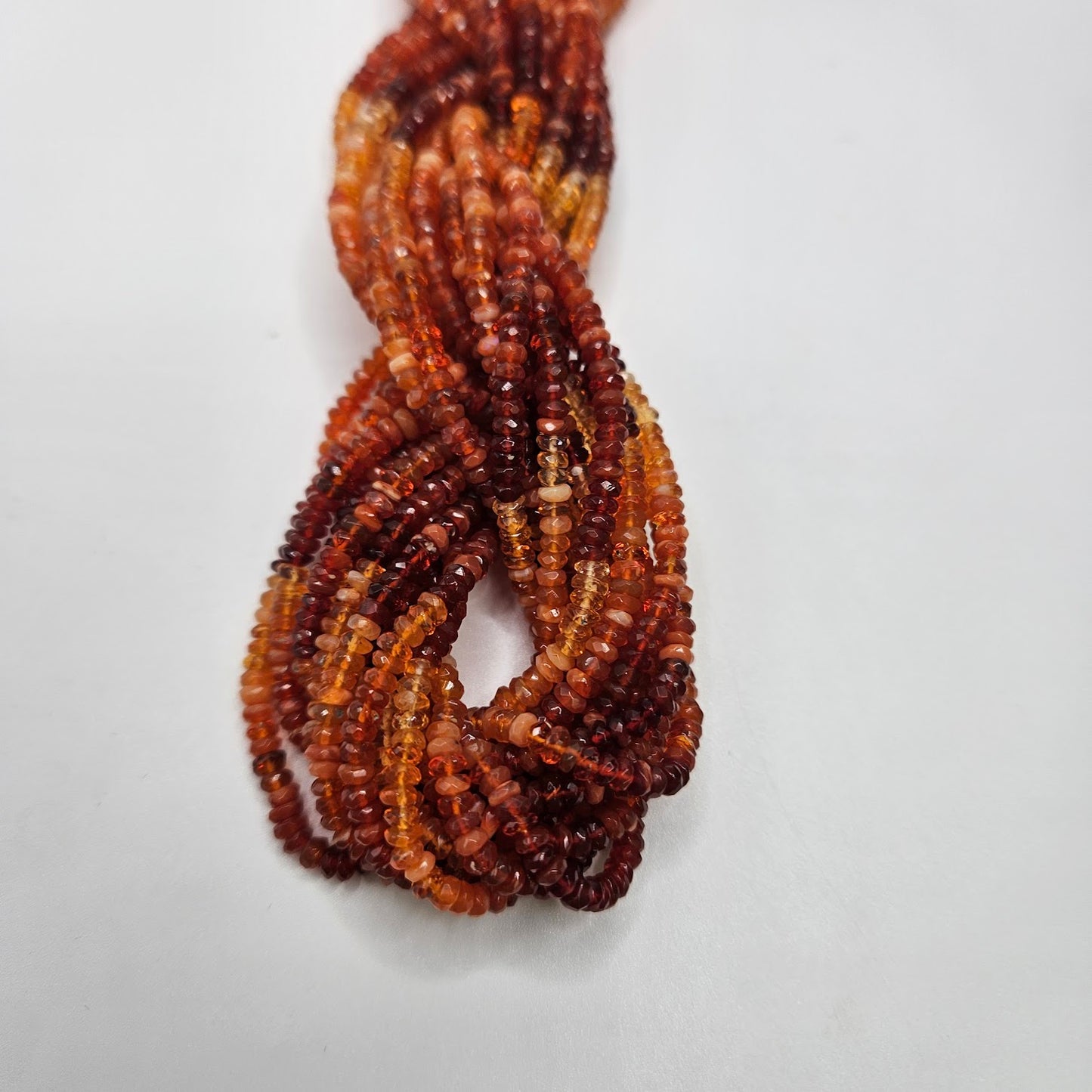 2mm Fire Opal Faceted Strand.