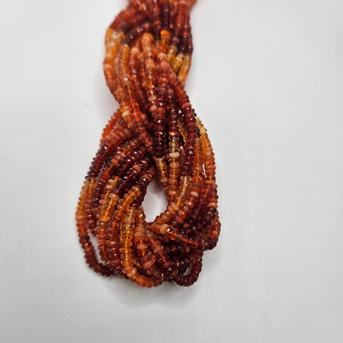 2mm Fire Opal Faceted Strand.