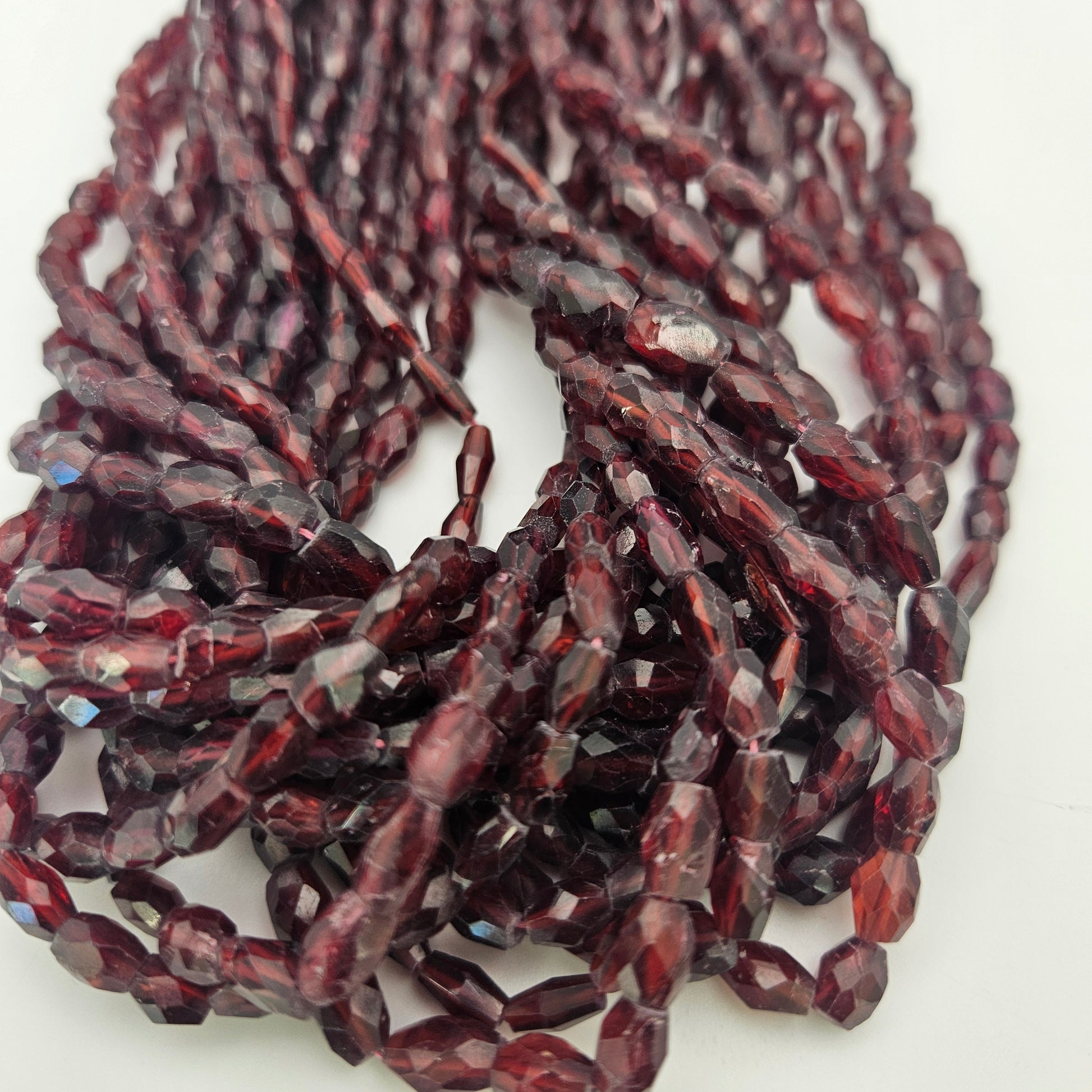3x8mm Faceted Garnet Tube Bead Strand.