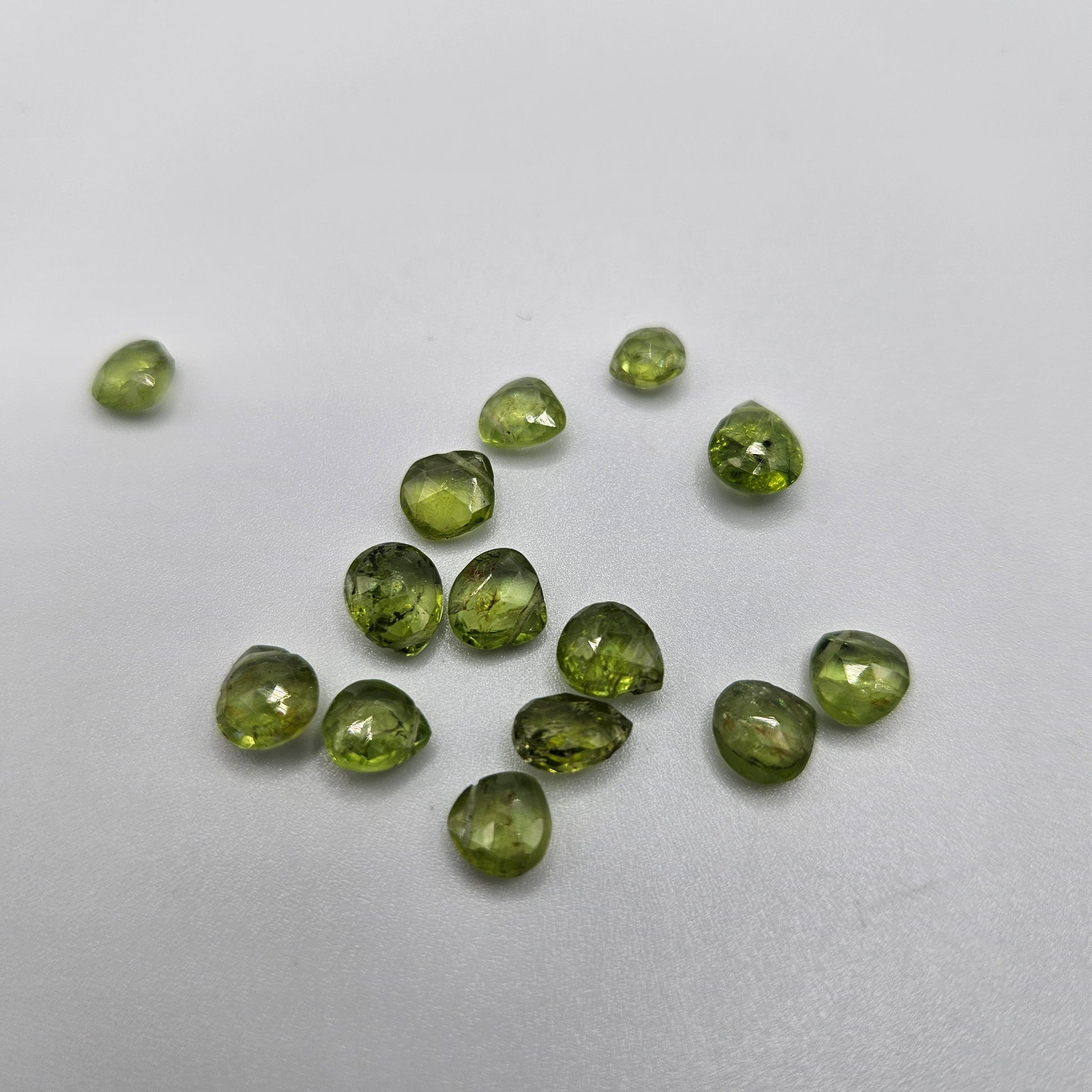 4 by 6mm faceted peridot top drill single bead.