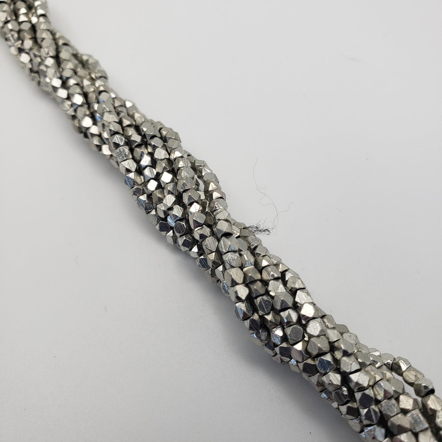 4mm Cubed Faceted Silver Seed Bead Strand.