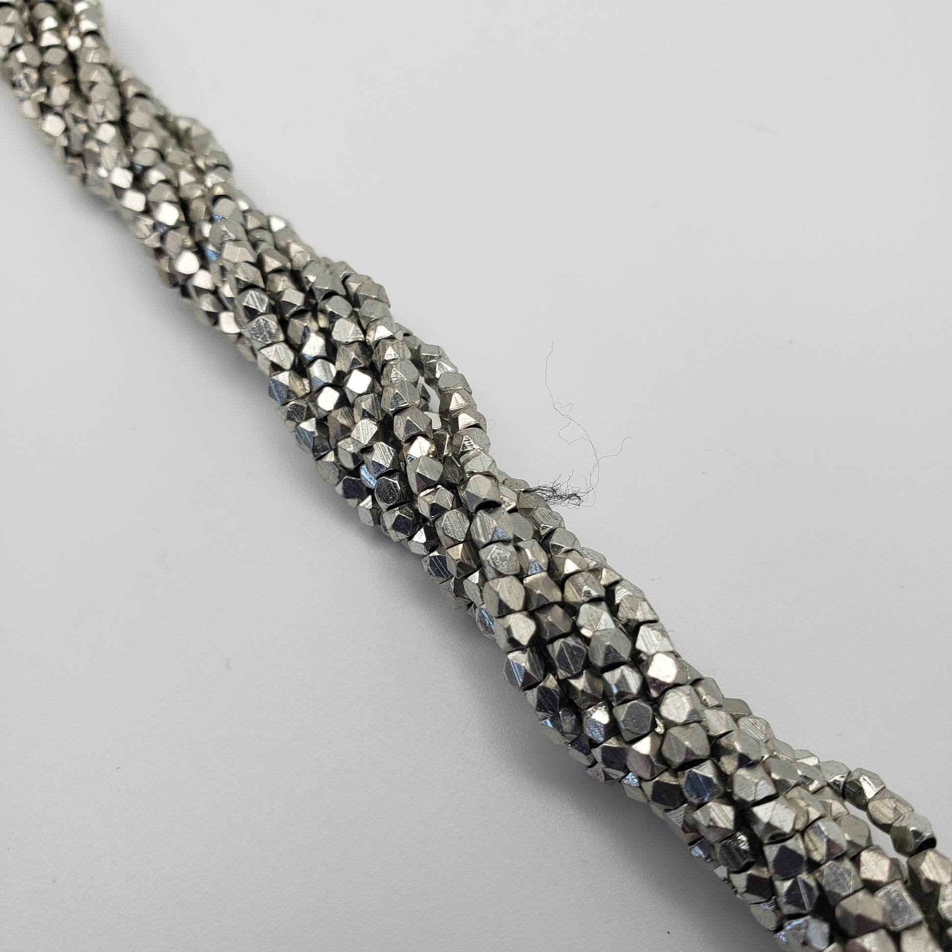 4mm Cubed Faceted Silver Seed Bead Strand.