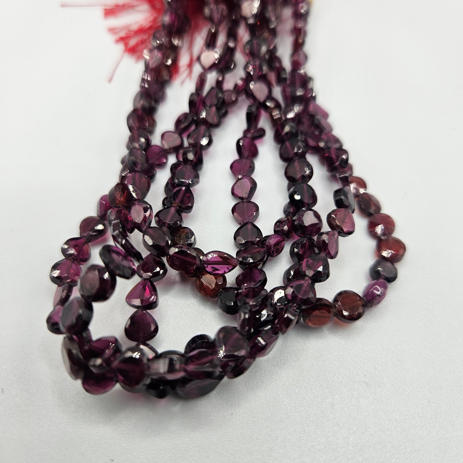 4mm faceted garnet tear drop bead strand.