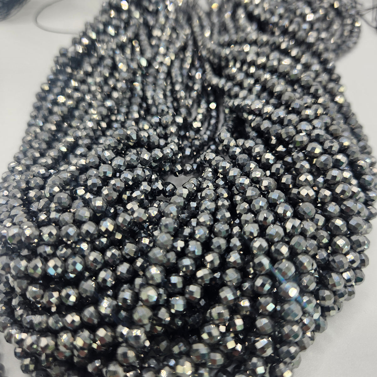 4mm Faceted Hematite Round Bead Strand.