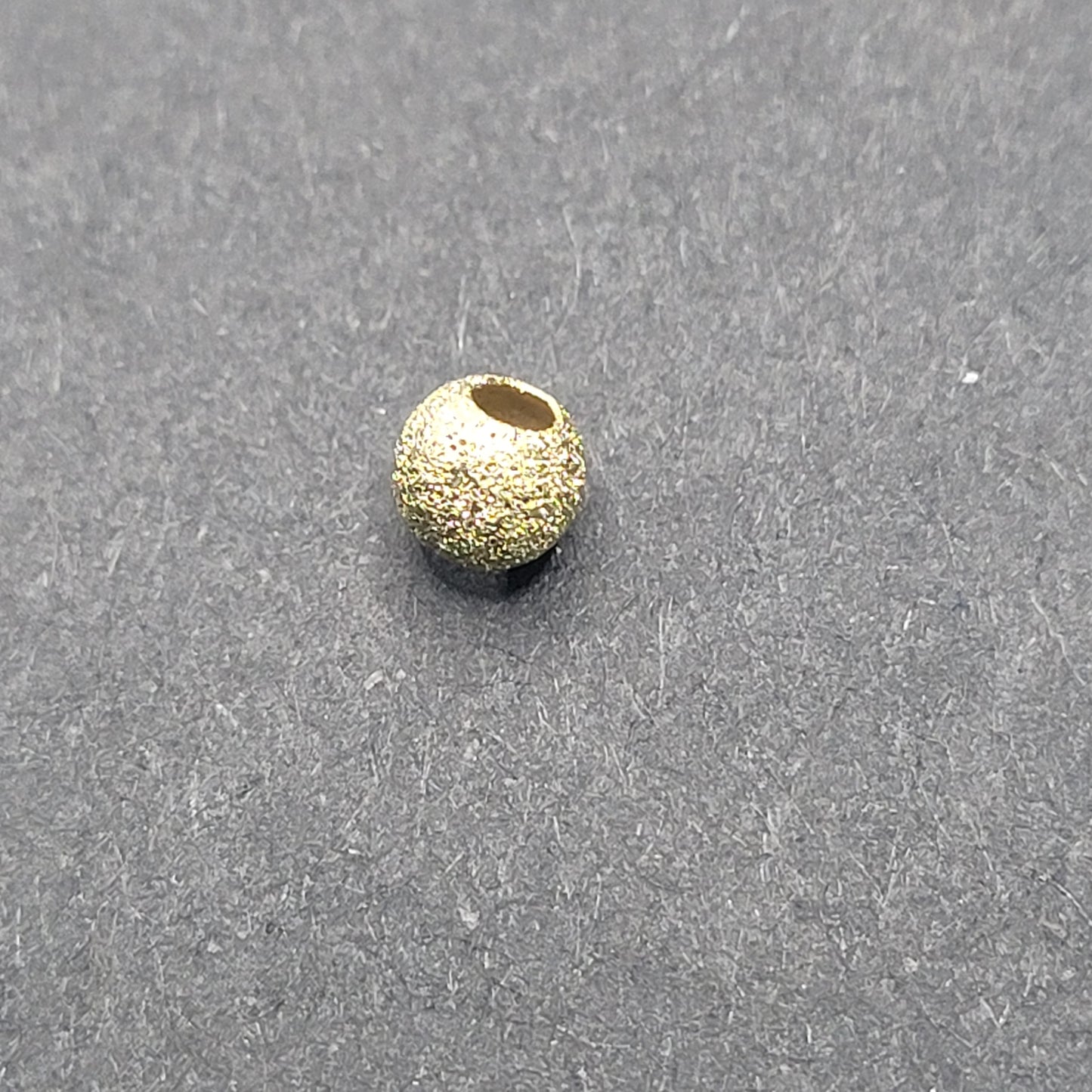 4mm Gold Filled Stardust Round Bead sold Individually.