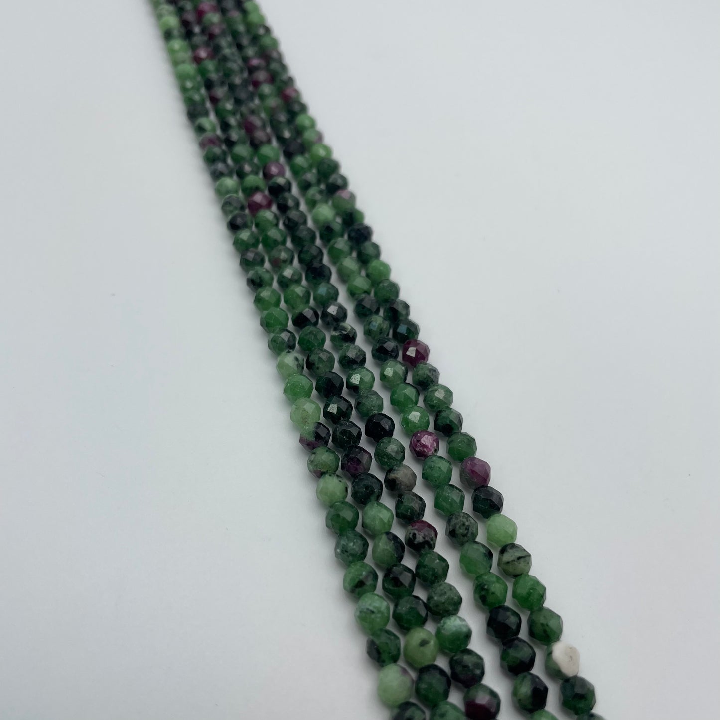4mm Ruby Zoisite faceted Round Bead Strand.