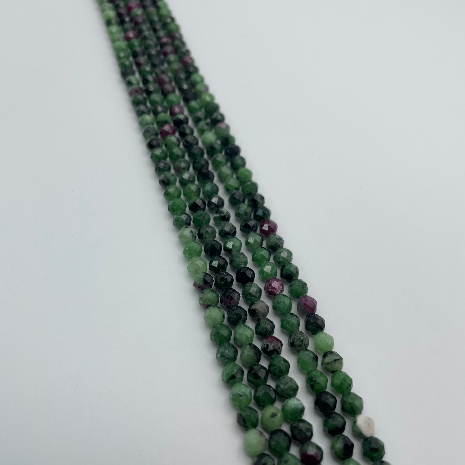 4mm Ruby Zoisite faceted Round Bead Strand.