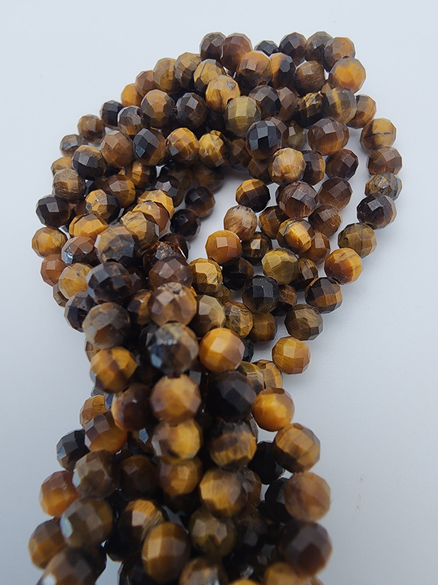 4mm Tiger's Eye Faceted Bead Strand.